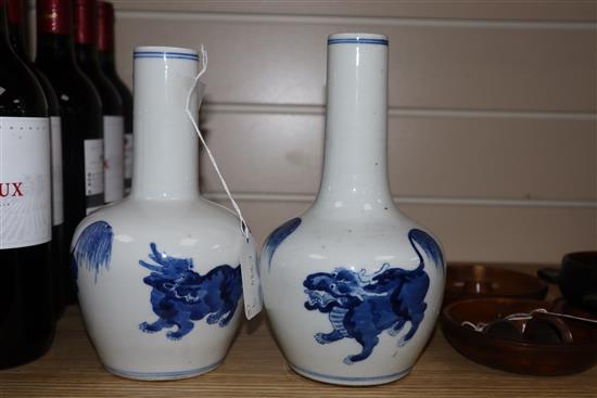 A pair of Chinese blue and white bottle vases tallest 22cm